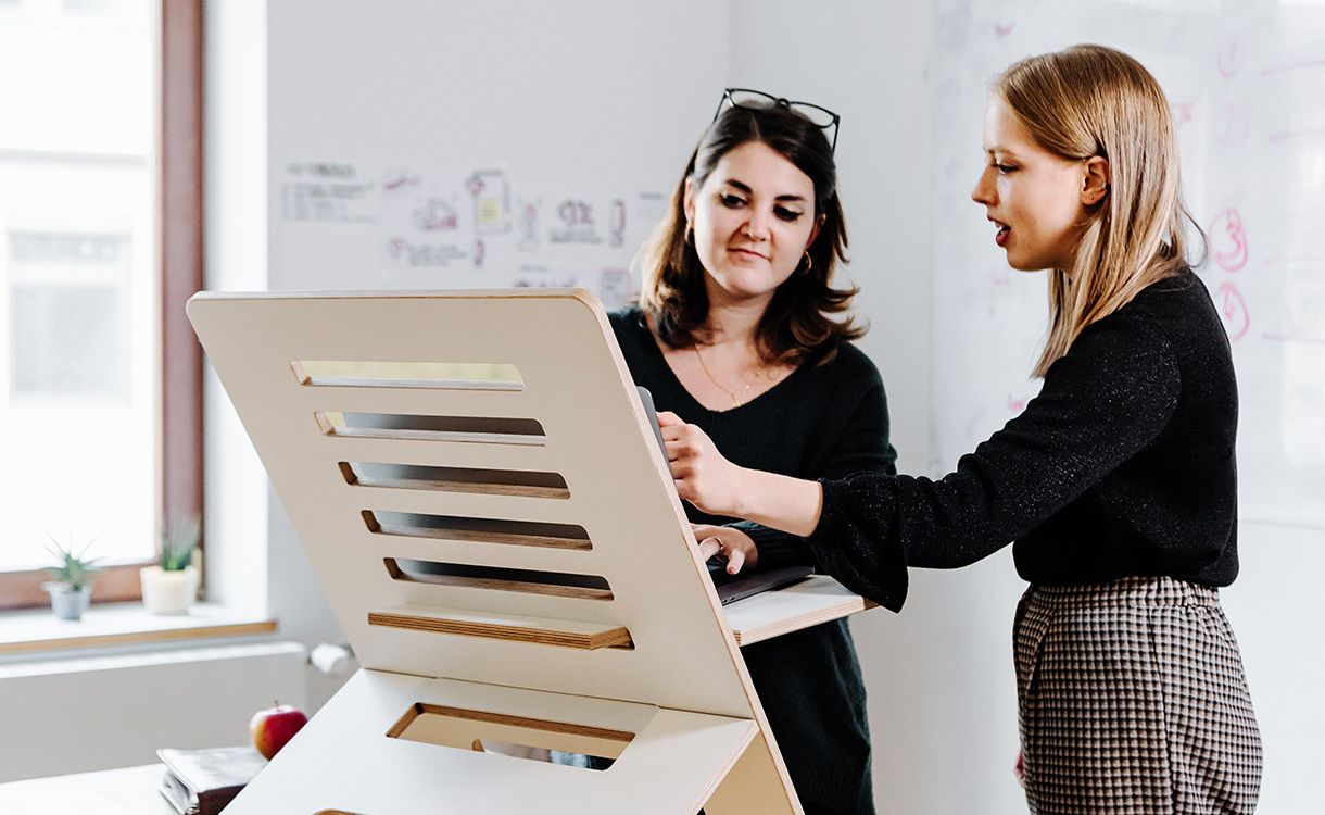 Two women looking at a computer