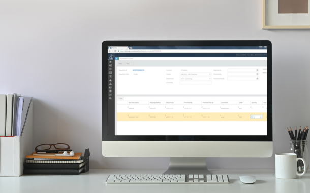 Image of computer on desk with Sales/Shipping/Inventory Module