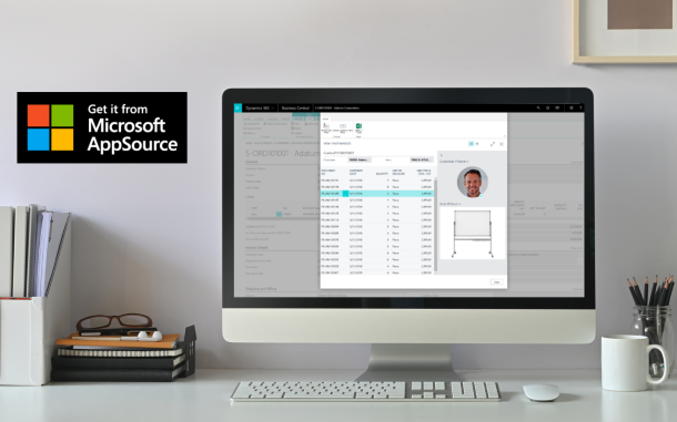 Image of computer on desk displaying the Customer Item Invoice History app
