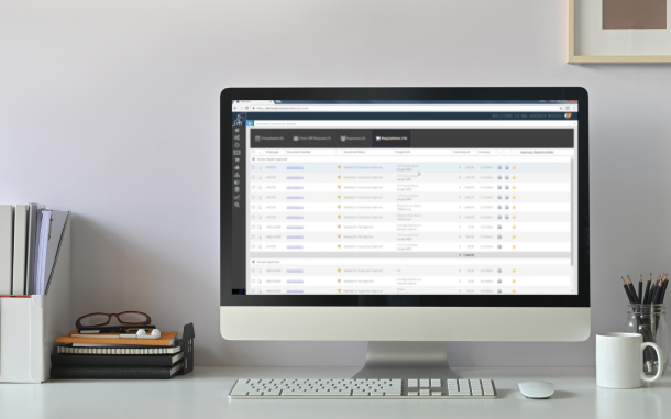 Image of computer on desk with Project Management Module